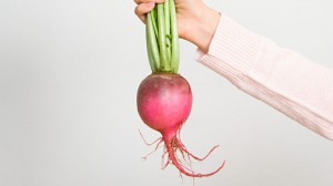 Person holding a radish
